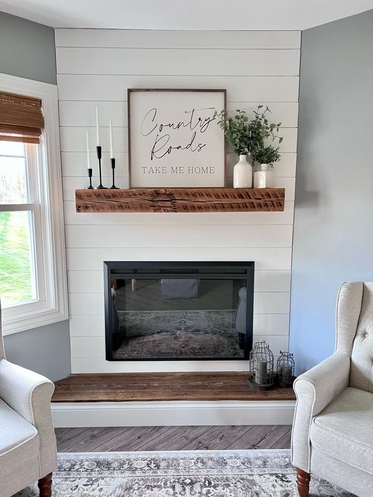 Large-scale abstract artwork hung above a fireplace mantel