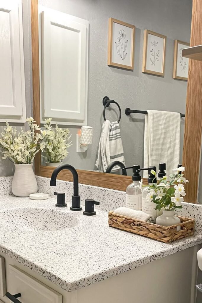 Decorative tray anchoring bathroom sink decor