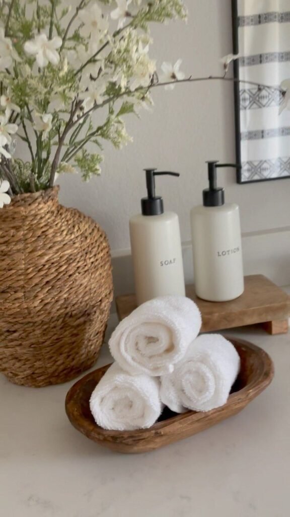 Minimal countertop storage styled near a bathroom sink