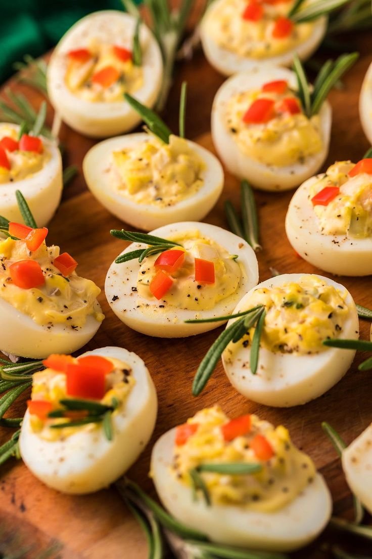 Deviled eggs with Christmas garnishes of paprika and herbs