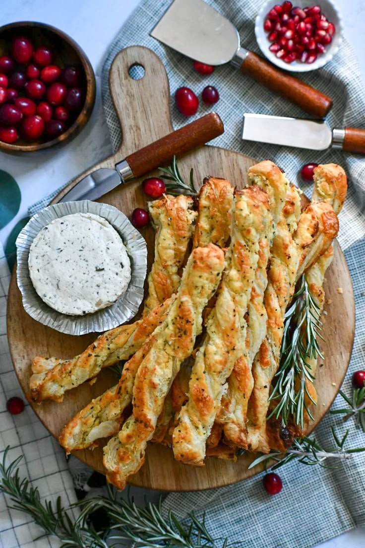 Parmesan puff pastry twists arranged with herbed cheese