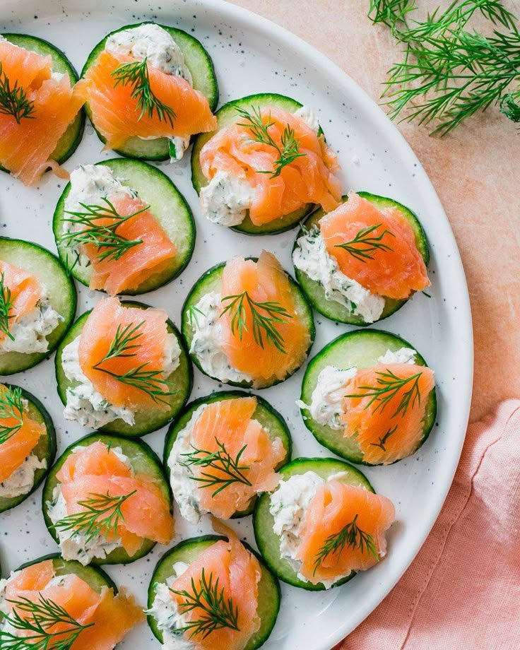 Smoked salmon cucumber bites with dill garnish