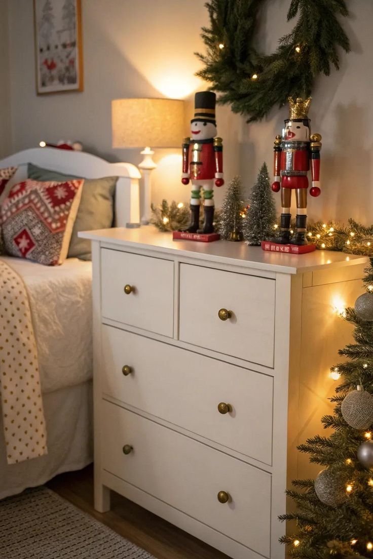Christmas decor styled on a dresser with nutcrackers and greenery