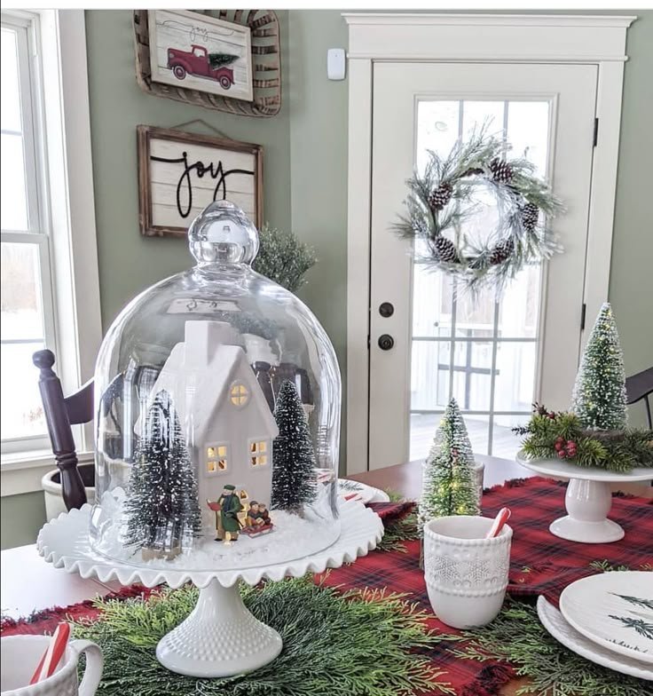 Glass cloche with a decorative accent as a subtle dining table centerpiece