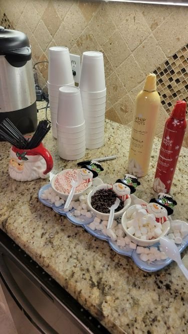 Movie night hot cocoa bar paired with cozy blankets and pillows