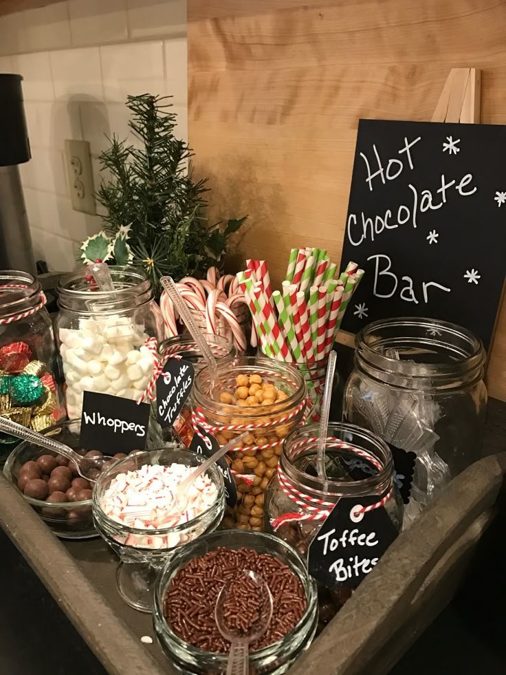 Well-organized hot cocoa bar with labeled toppings