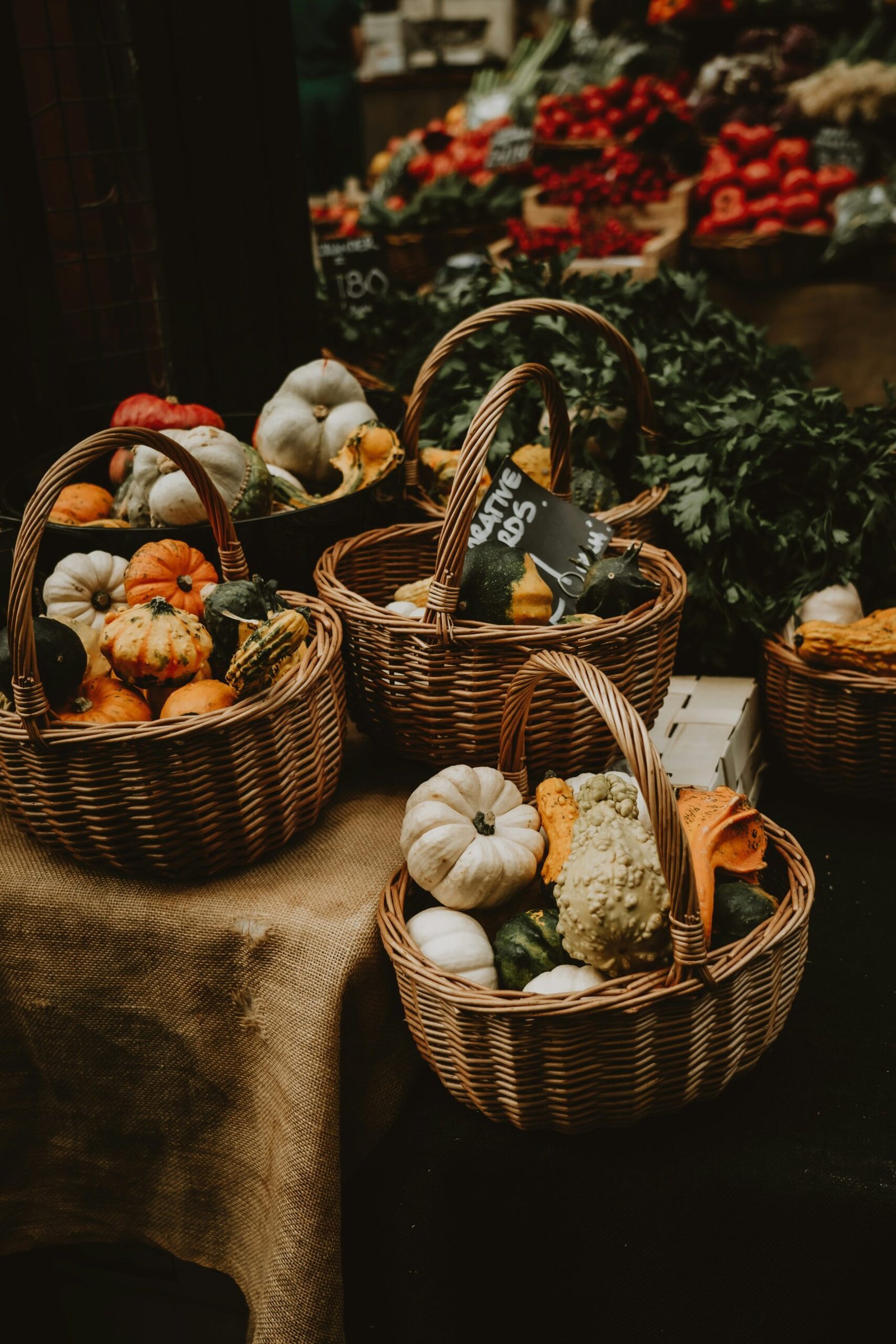 A beautifully arranged fall gift basket full of seasonal items