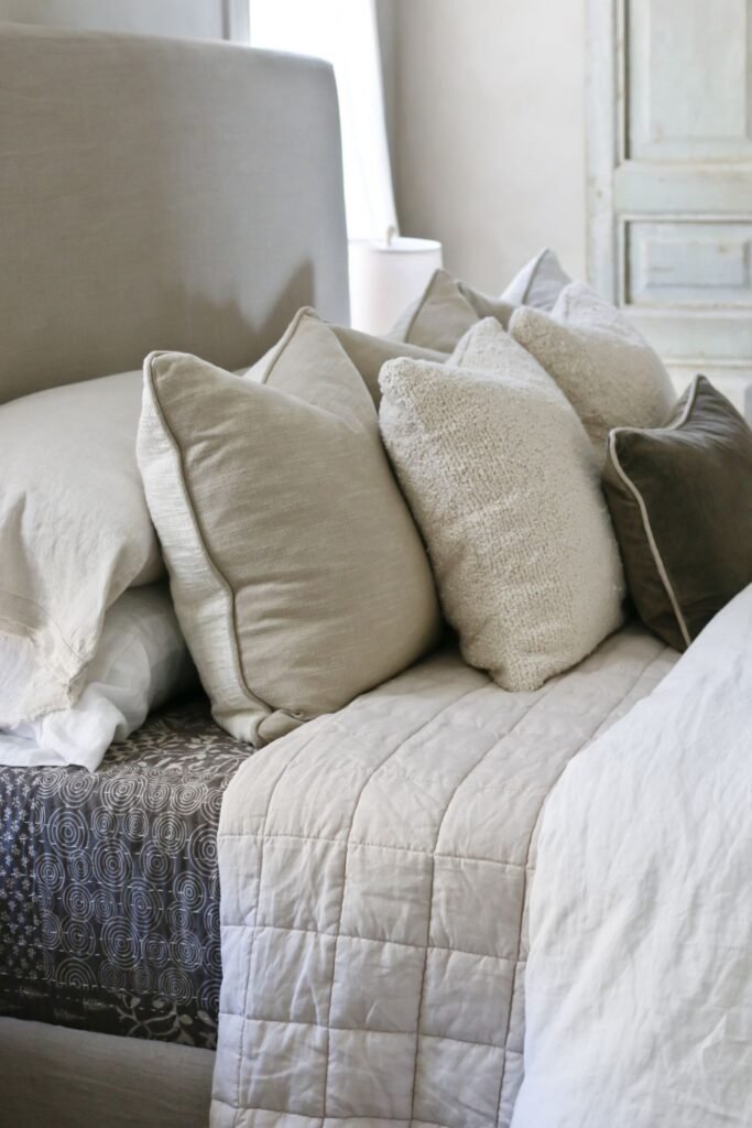 Freshly fluffed pillows maintaining a plush bed appearance