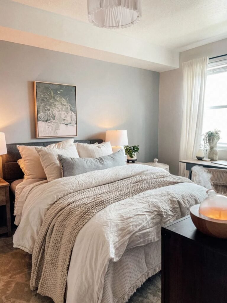 Bed with voluminous, textured bedding demonstrating fluffy styling