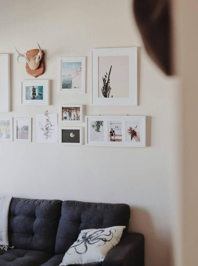 Eclectic gallery wall mixing various art styles and themes