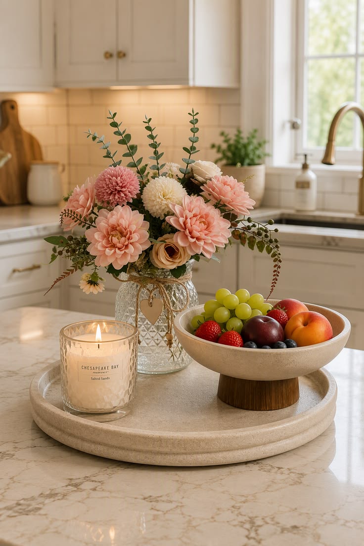 Ceramic fruit bowl and candle styled on a kitchen counter
