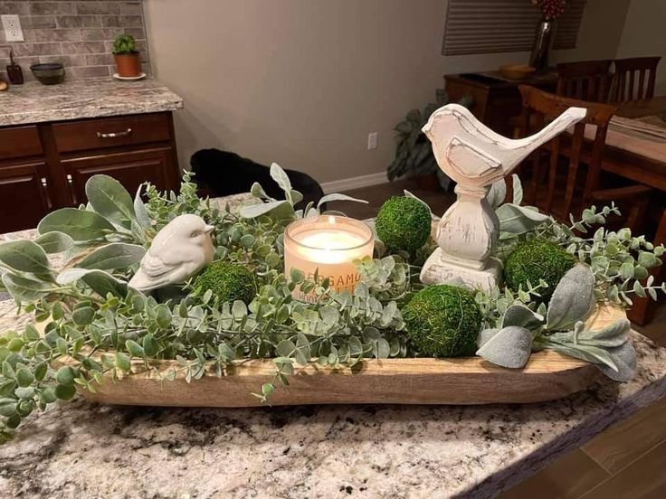 Wooden dough bowl centerpiece styled on a kitchen island