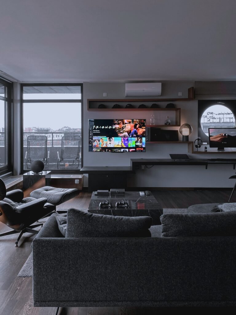 Light neutral accents providing balance within a dark, moody room