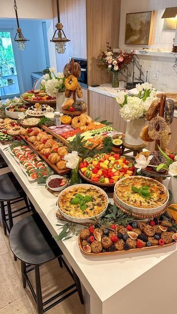 Effortless brunch party table setup with light linens and fresh fruit