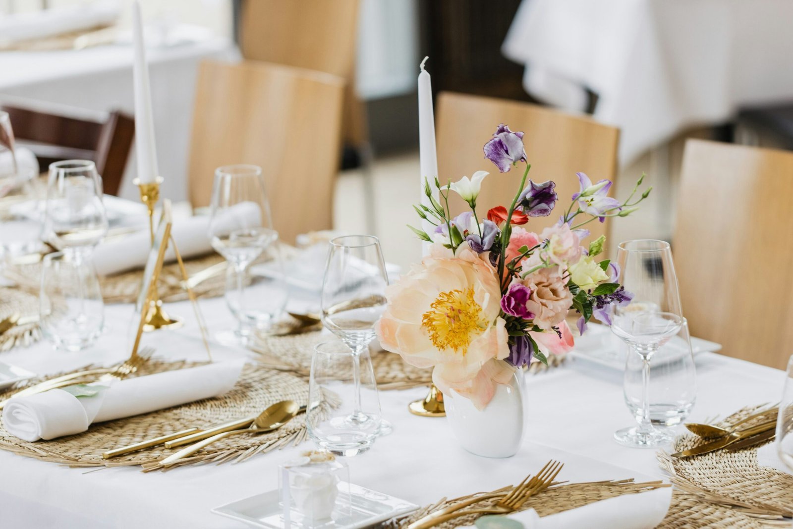 Beautifully styled party table setup with layered serving pieces and decor