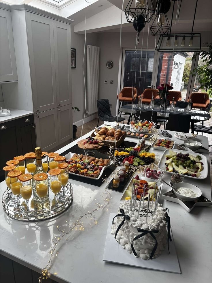 Minimal party table setup with a tight color palette and clean serving dishes