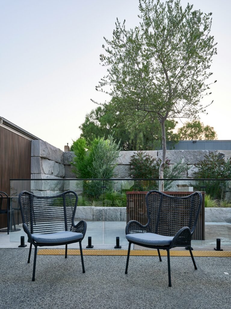Concrete paver patio creating a sleek, modern backyard look