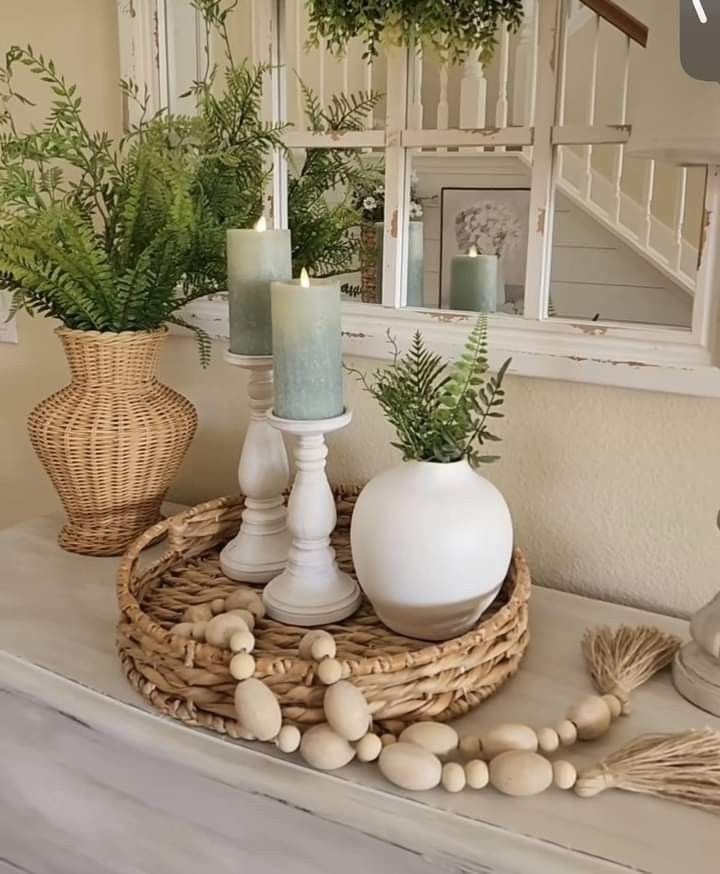 Round tray styled on an entryway table with keys, mail and a small dish