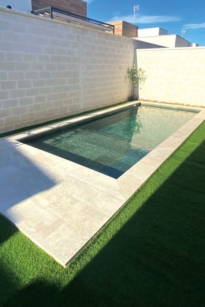 Corner pool making smart use of an awkward backyard space