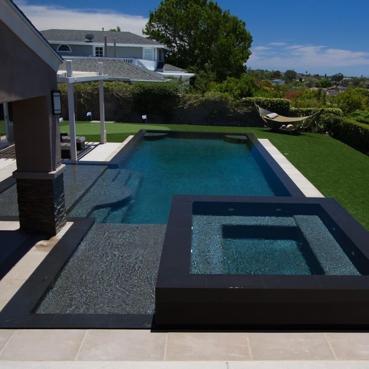 Dark-finish pool creating an illusion of depth in a small space