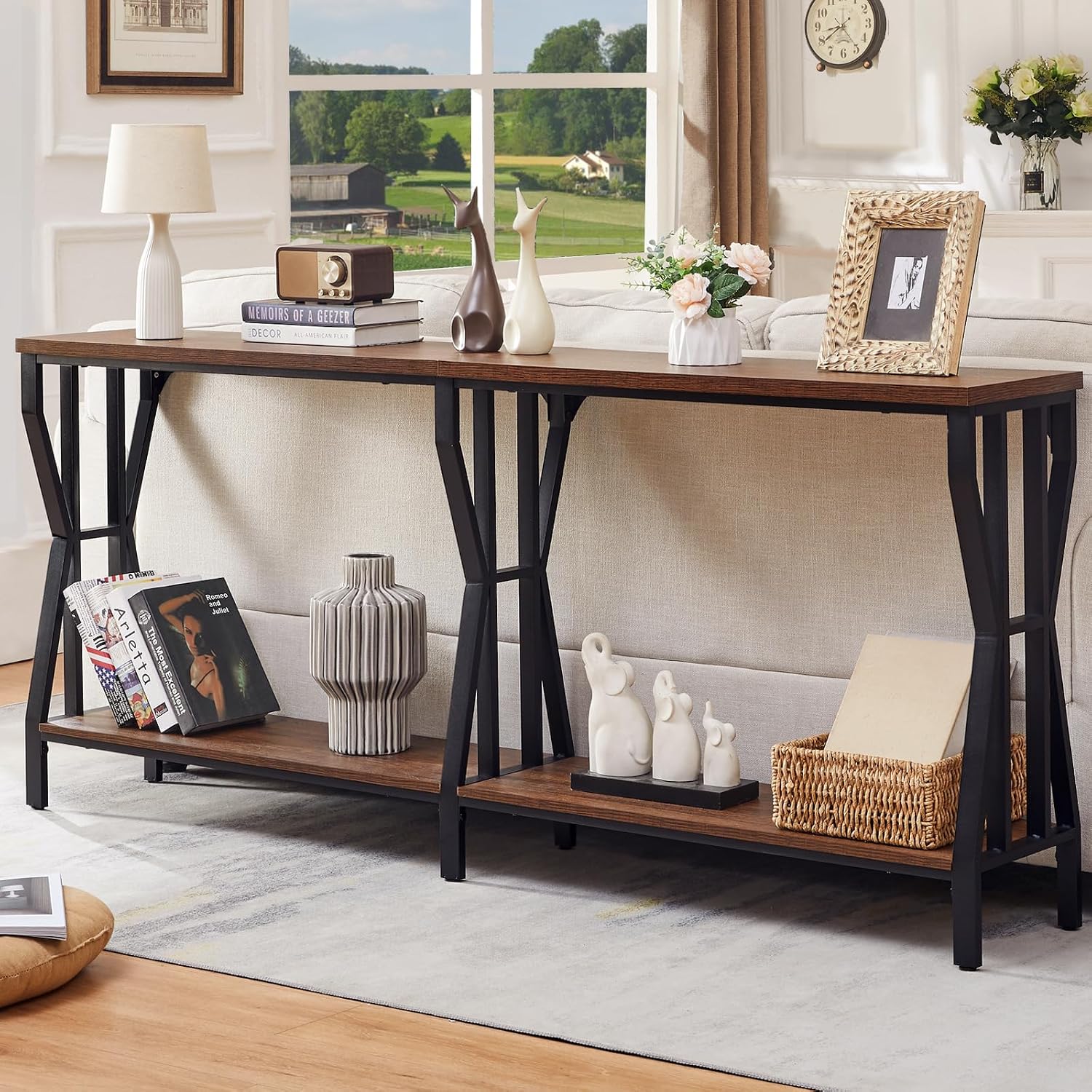 Wood console table styled with vases and frames, sized to sit behind a floated sofa