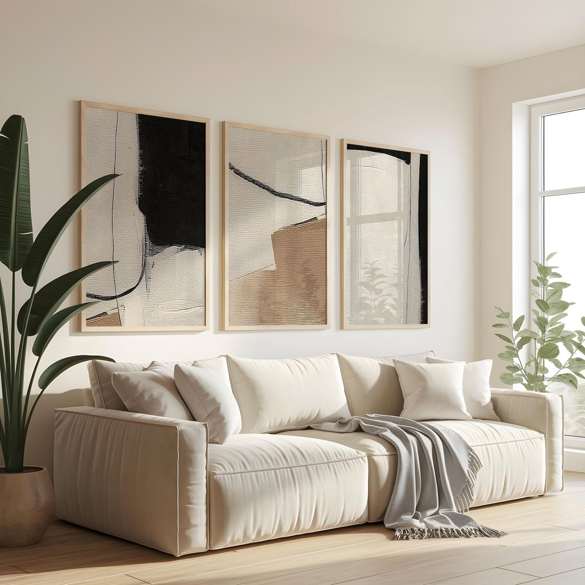 Two large abstract art panels sized close to the width of the sofa beneath them
