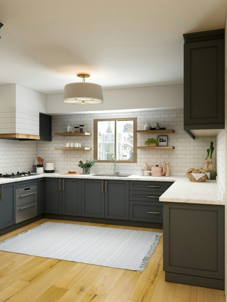 Dark green U-shaped kitchen cabinets wrapping three walls with open wood shelving, subway tile backsplash and a pendant light
